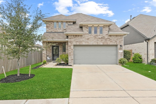 view of front of property featuring brick siding, fence, concrete driveway, roof with shingles, and a front lawn