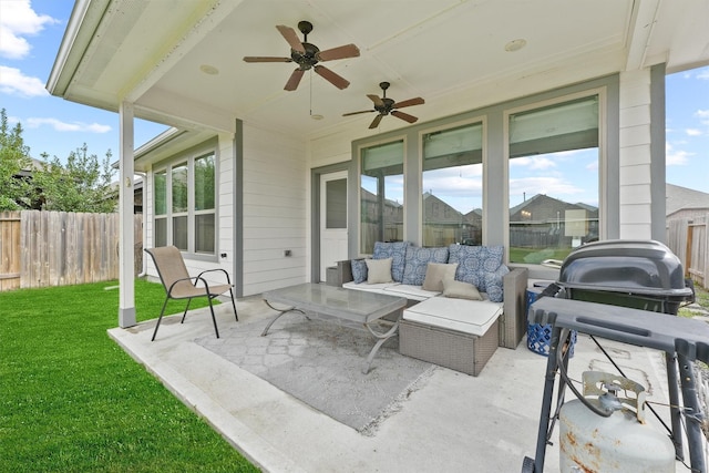 view of patio with a ceiling fan and fence