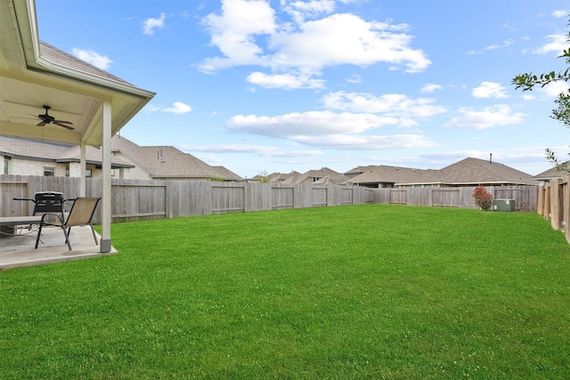 view of yard with a fenced backyard, a patio, and ceiling fan