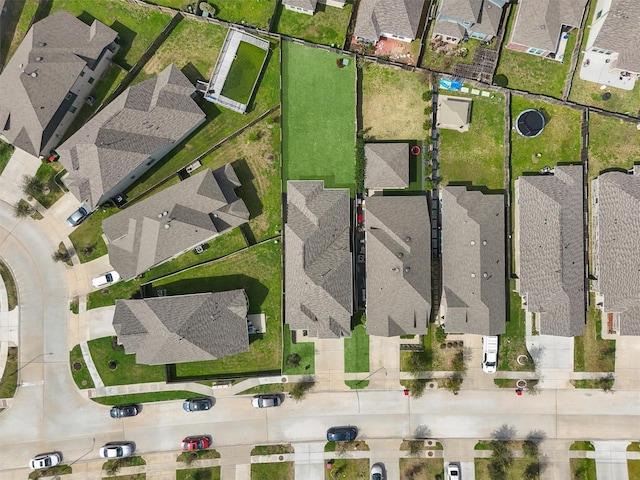 birds eye view of property with a residential view