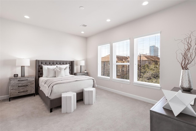 bedroom featuring recessed lighting, baseboards, light colored carpet, and visible vents