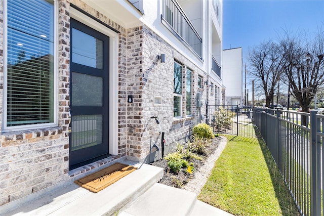 view of exterior entry with fence