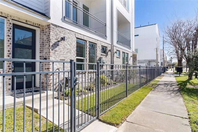 surrounding community featuring a residential view and fence