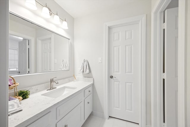 bathroom with vanity and tile patterned flooring