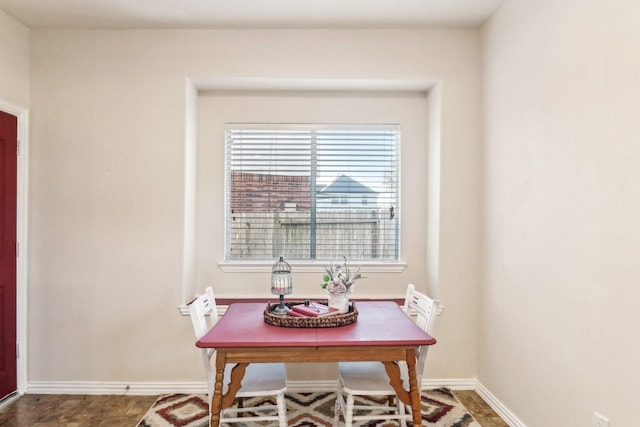 dining room featuring baseboards