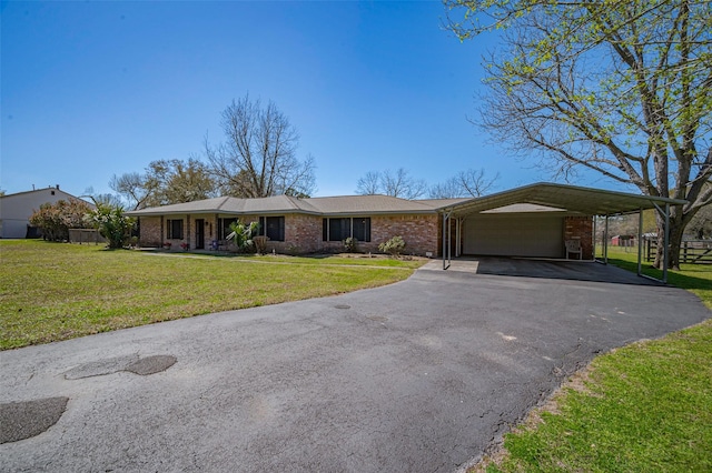 ranch-style house featuring aphalt driveway, brick siding, a front lawn, and fence