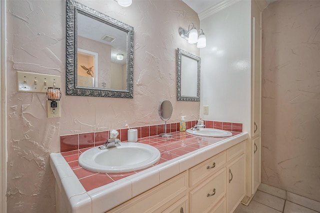 full bath with double vanity, visible vents, tile patterned flooring, and a sink