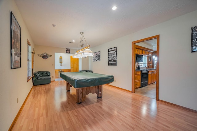 game room with billiards, visible vents, baseboards, light wood finished floors, and a textured ceiling