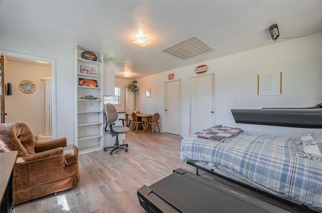 bedroom with light wood finished floors