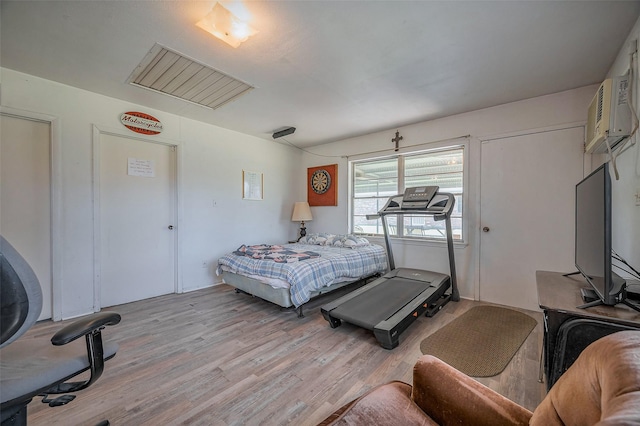 bedroom featuring light wood-style flooring