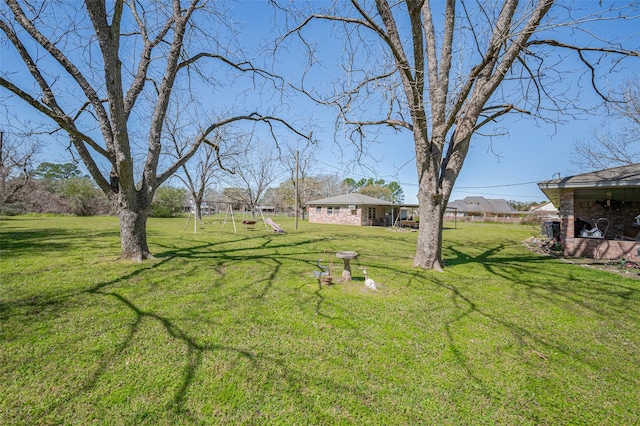 view of yard with a playground