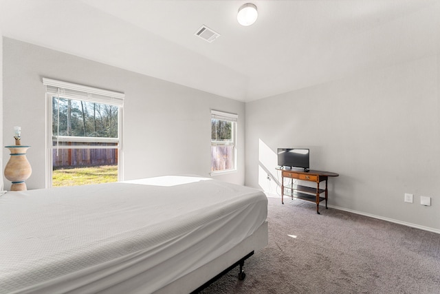 carpeted bedroom with baseboards and visible vents