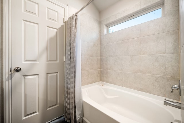 full bathroom featuring shower / tub combo with curtain