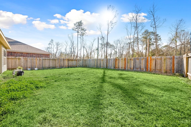 view of yard featuring a fenced backyard