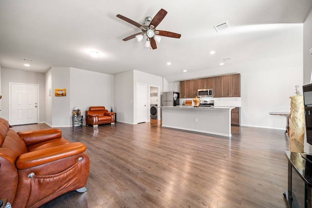 living area with washer / dryer, visible vents, a ceiling fan, dark wood-type flooring, and recessed lighting