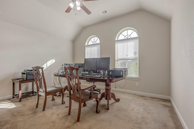 office area with carpet, vaulted ceiling, visible vents, baseboards, and ceiling fan