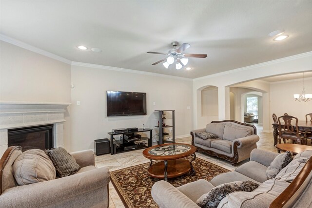 living room with baseboards, arched walkways, and recessed lighting