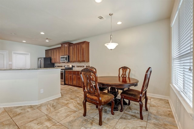 dining space featuring baseboards, visible vents, recessed lighting, and light tile patterned floors
