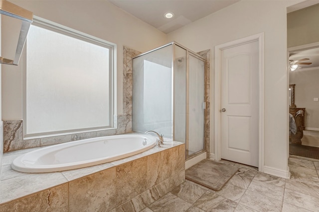 bathroom with a bath, a shower stall, marble finish floor, and ceiling fan