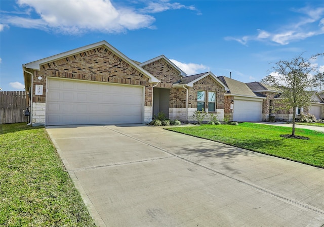 ranch-style house featuring brick siding, an attached garage, a front lawn, fence, and driveway