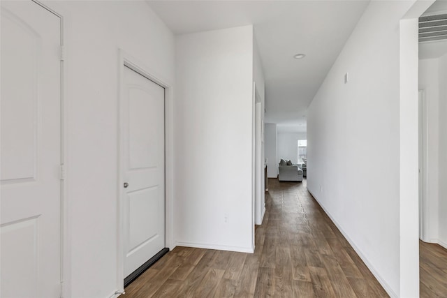 hallway featuring wood finished floors