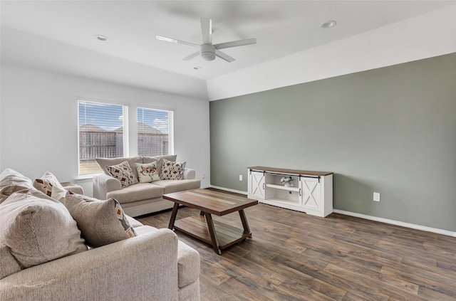 living room with vaulted ceiling, a ceiling fan, baseboards, and wood finished floors