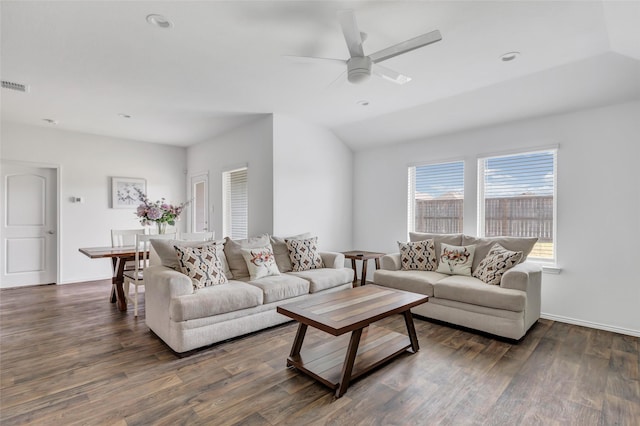 living room with visible vents, baseboards, lofted ceiling, wood finished floors, and a ceiling fan