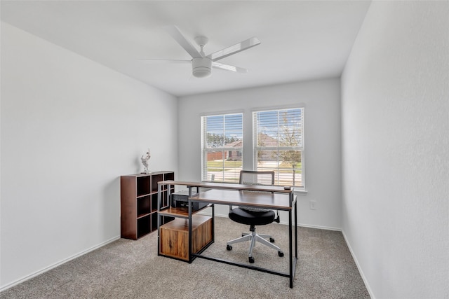 home office with baseboards, a ceiling fan, and carpet flooring