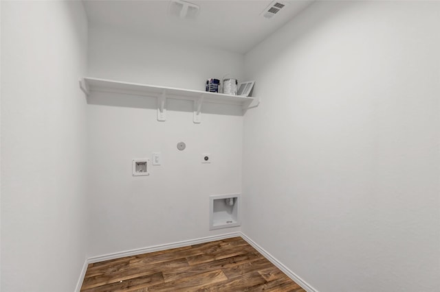 clothes washing area featuring visible vents, laundry area, hookup for an electric dryer, gas dryer hookup, and dark wood-style flooring