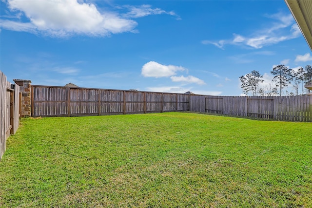 view of yard featuring a fenced backyard