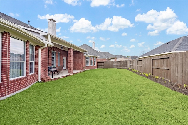 view of yard with a patio and a fenced backyard