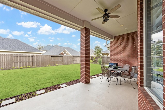 view of patio / terrace featuring outdoor dining area, a fenced backyard, and ceiling fan