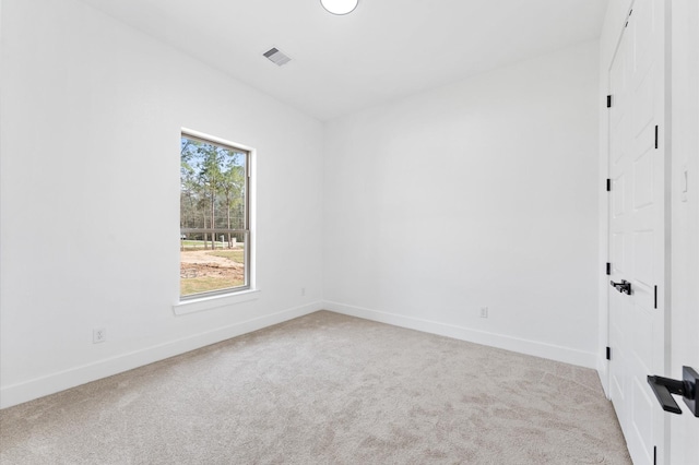 unfurnished bedroom with carpet floors, visible vents, and baseboards