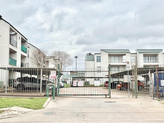 view of gate featuring fence