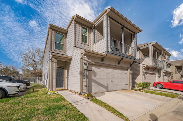 townhome / multi-family property with fence, a front lawn, a balcony, driveway, and a garage