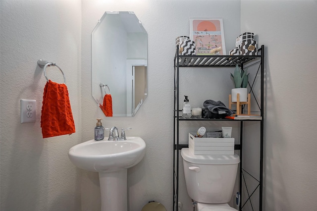 half bath featuring toilet