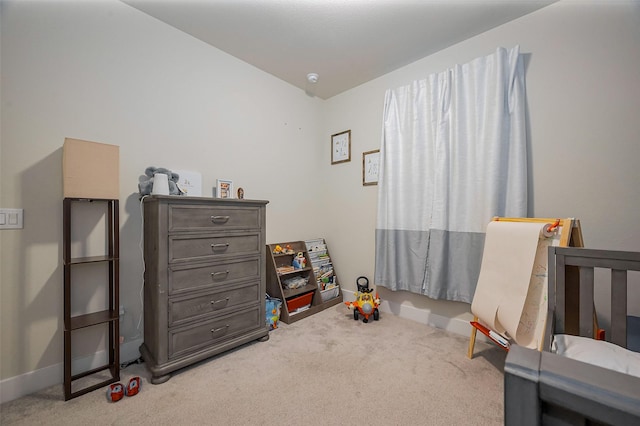bedroom with carpet floors and baseboards