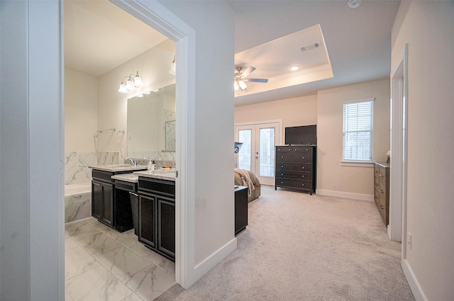 full bathroom featuring visible vents, a ceiling fan, vanity, french doors, and a bath