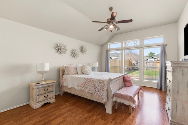 bedroom featuring lofted ceiling, wood finished floors, a ceiling fan, and baseboards