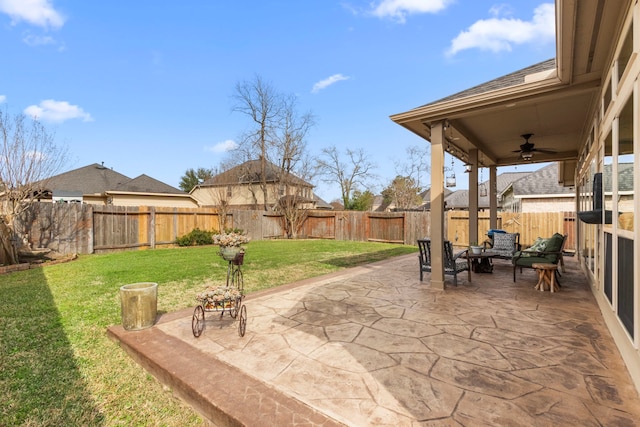 view of patio / terrace with a fenced backyard and a ceiling fan