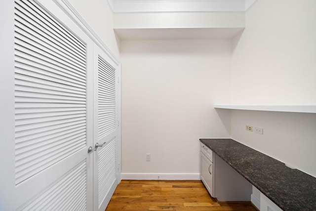 interior space with light wood-style flooring and baseboards