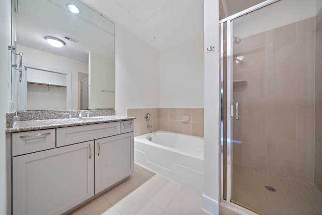 full bathroom with visible vents, a garden tub, tile patterned flooring, vanity, and a shower stall