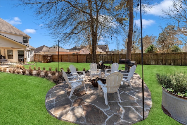 view of patio featuring area for grilling and a fenced backyard