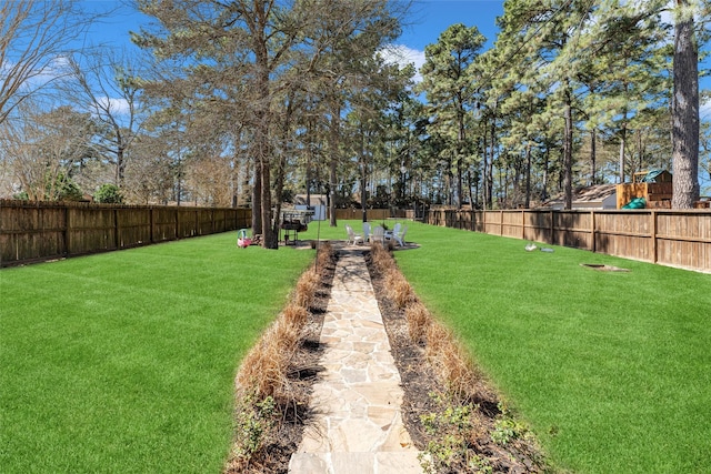 view of yard with a fenced backyard