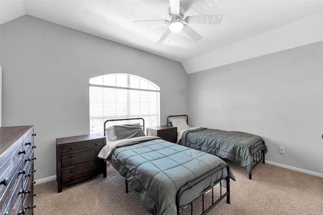 bedroom with lofted ceiling, light carpet, ceiling fan, and baseboards