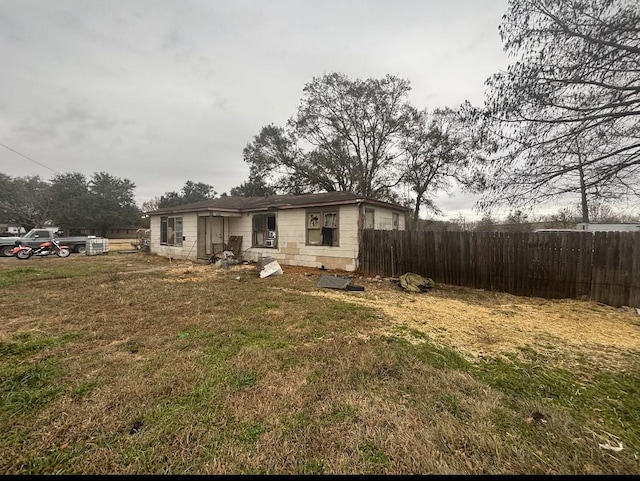 view of front of house featuring fence