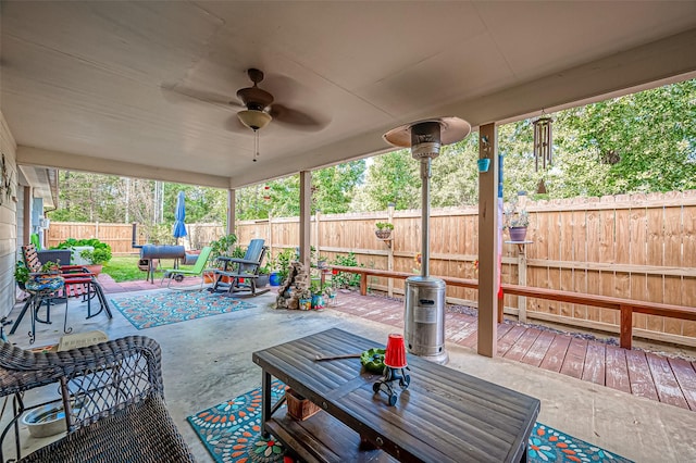 view of patio / terrace featuring outdoor lounge area, a fenced backyard, and ceiling fan