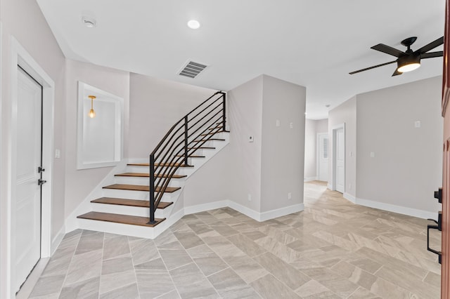 interior space featuring recessed lighting, visible vents, ceiling fan, and baseboards