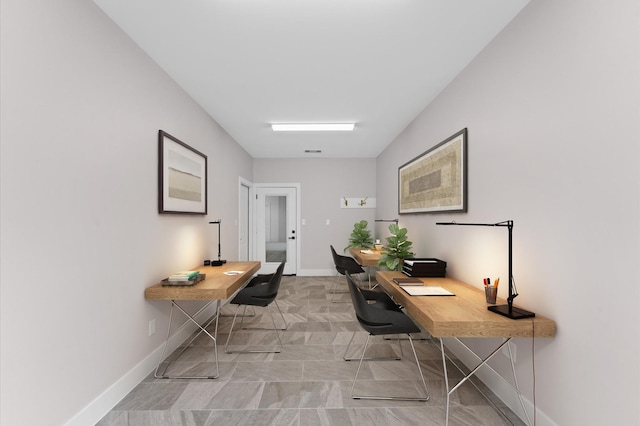 home office featuring visible vents and baseboards