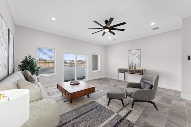 living room featuring recessed lighting, visible vents, baseboards, and a ceiling fan